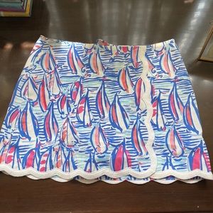Lilly Pulitzer skirt. Colors are dark blue, light blue, pink and white. Size 0